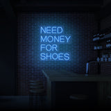 "BEHÖVER PENGAR FÖR SKO" NEONSKYLT